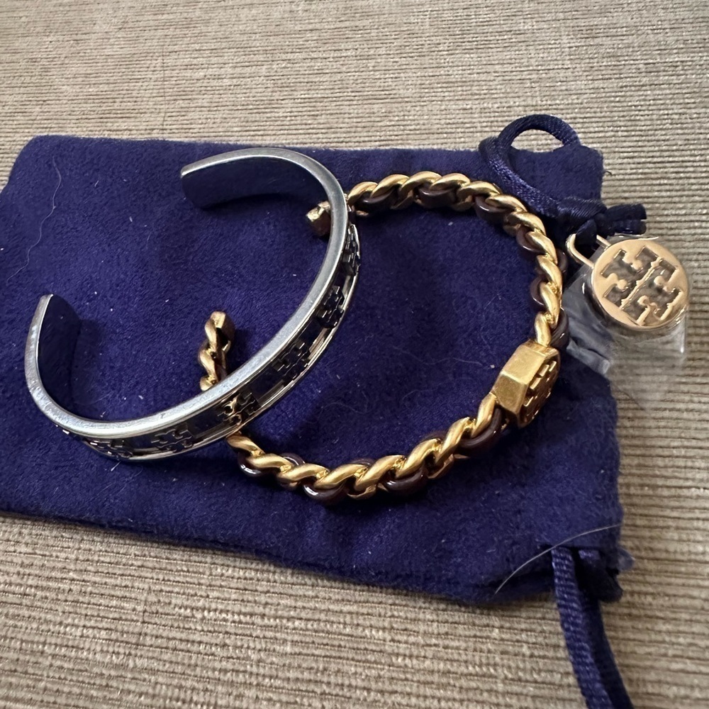 2 Tory Burch cuff bracelets.